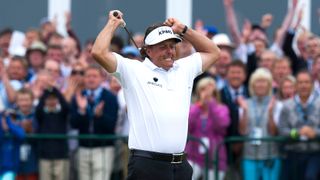 Phil Mickelson celebrates after birdieing the last hole at Muirfield to win the 2013 Open