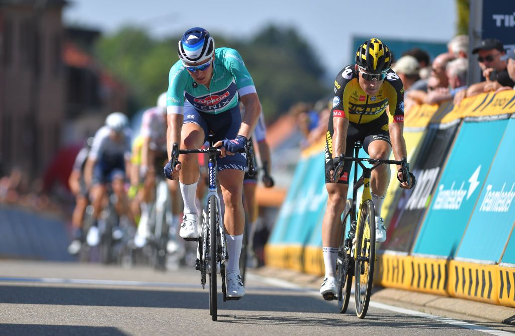 BILZEN BELGIUM SEPTEMBER 03 Tim Merlier of Belgium and Team AlpecinFenix Turquoise points jersey and Mike Teunissen of Netherlands and Team Jumbo Visma react after cross the finishing line during the 17th Benelux Tour 2021 Stage 5 a 188km stage from Riemst to Bilzen BeneluxTour on September 03 2021 in Bilzen Belgium Photo by Luc ClaessenGetty Images