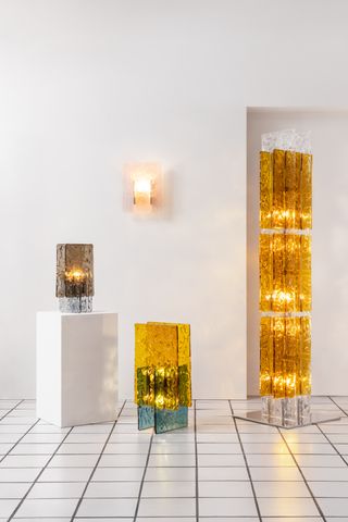 Different Murano glass lights, including a sconce and three standing pieces.