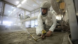 NASA engineers use fake lunar regolith to prepare for moon landing.