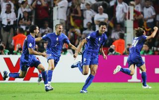 Italy players celebrate Fabio Grosso's extra-time goal against Germany