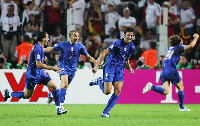 Italy players celebrate Fabio Grosso&#039;s extra-time goal against Germany