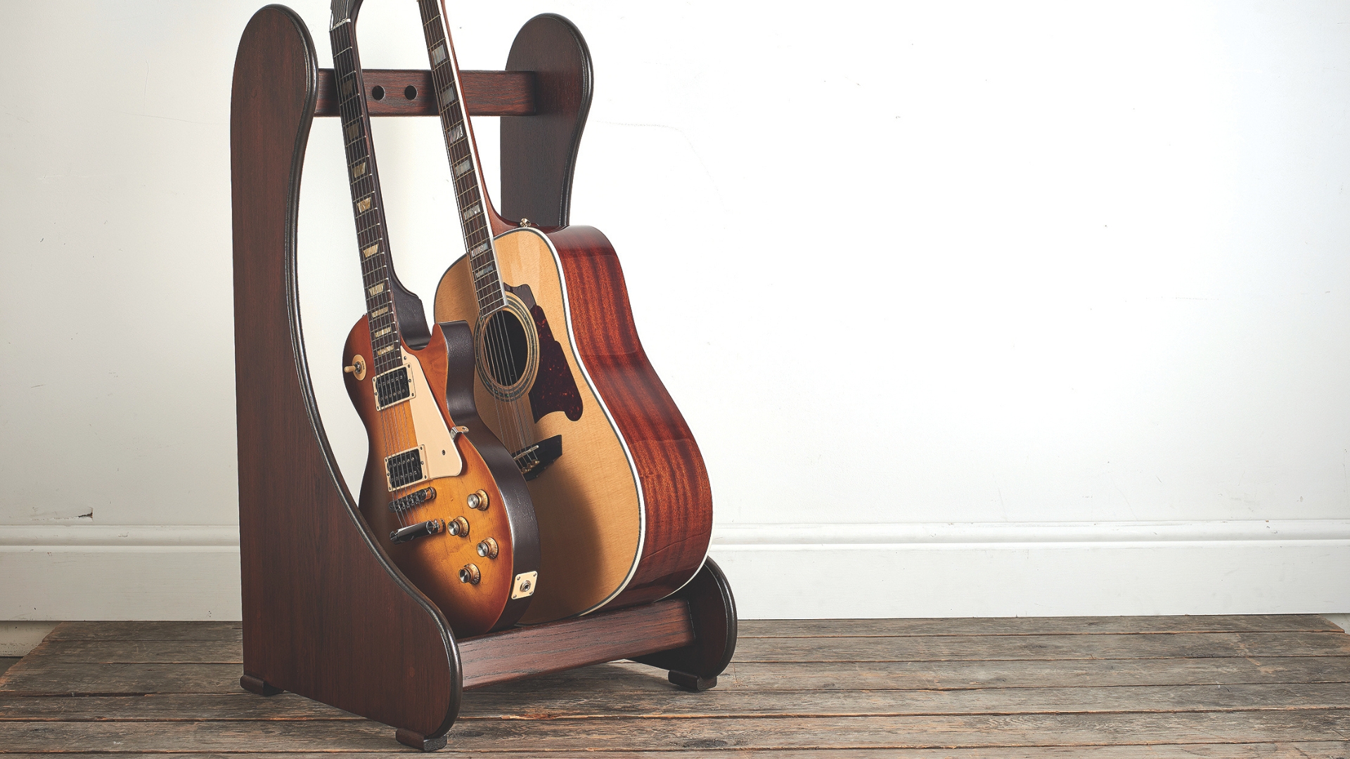 Two guitars on a multi-guitar rack