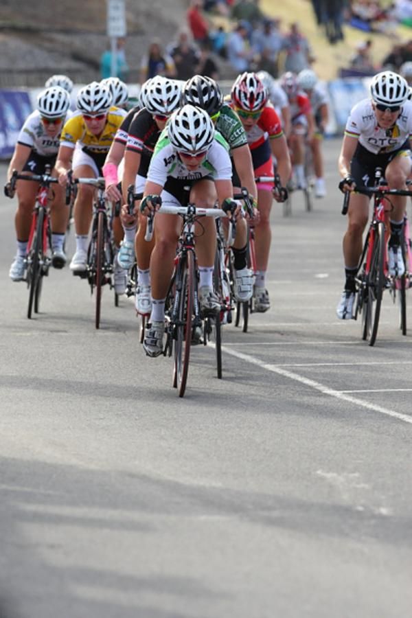 Tiffany Cromwell (Honda) leads the train for leader, Rochelle Gilmore with a lap to go