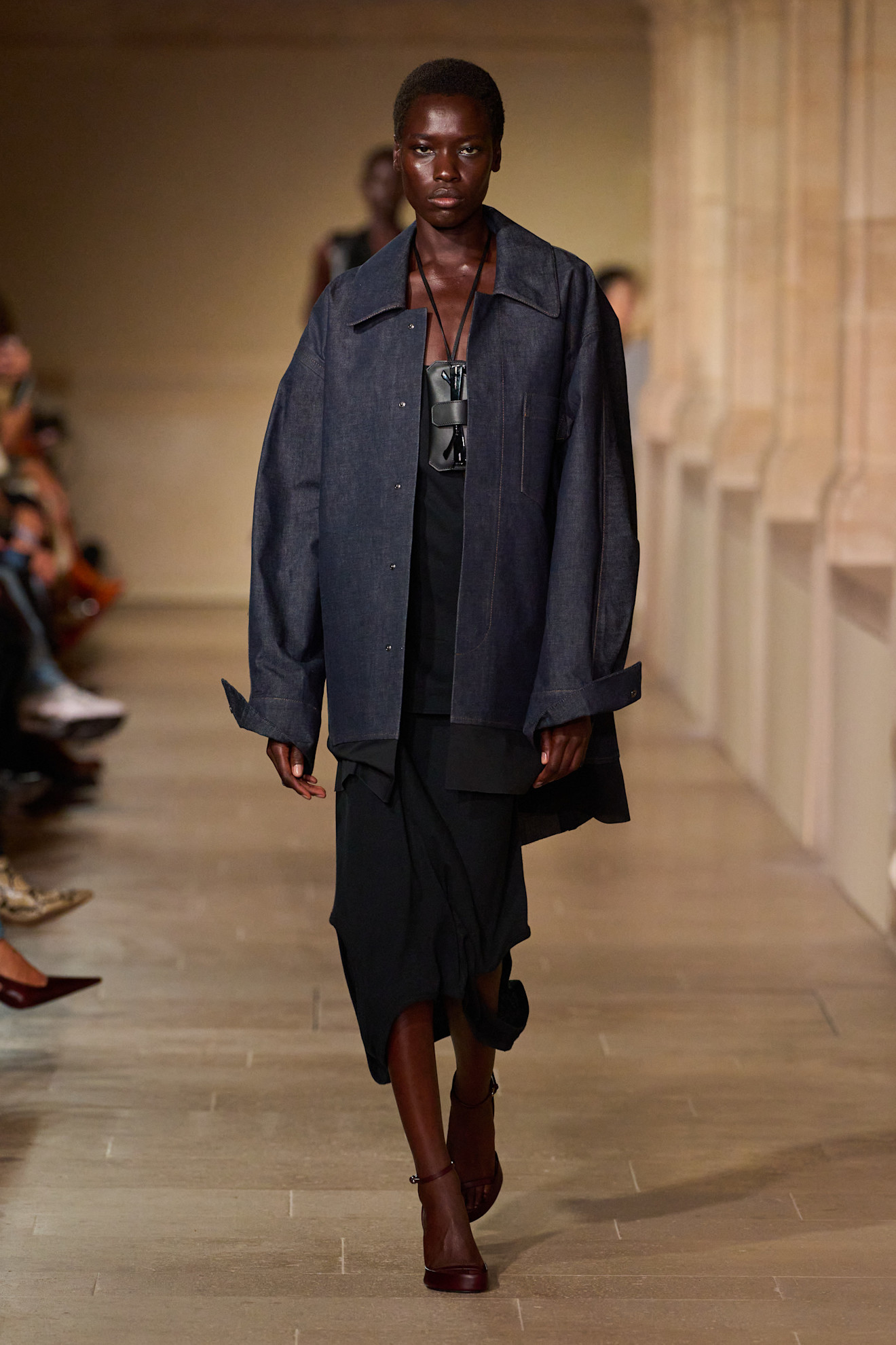 Victoria Beckham runway model wearing a denim shacket.