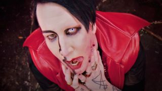 Marilyn Manson with tongue sticking out in Kill4Me music video