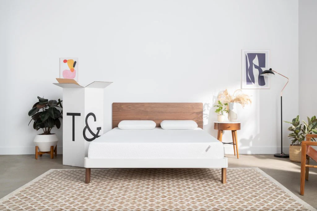 bed in room with wooden walls