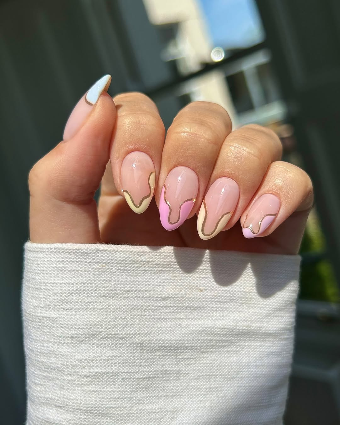 pastel french manicure lined in gold chrome