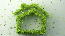 green leaves arranged in the shape of a house on white background