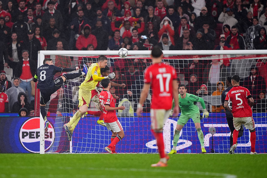 Anatoliy Trubin of Benfica scores his team's fourth goal with a header as Thibaut Courtois of Real Madrid fails to make a save during the UEFA Champions League 2025/26 League Phase MD8 match between SL Benfica and Real Madrid C.F. at Estadio do SL Benfica on January 28, 2026 in Lisbon, Portugal