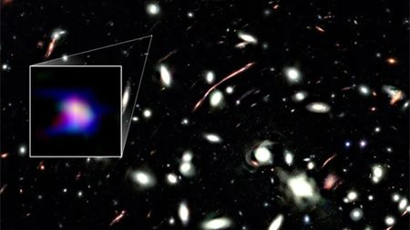 A deep space photo with a boxout to the left encircling a smear of blue and purple light.