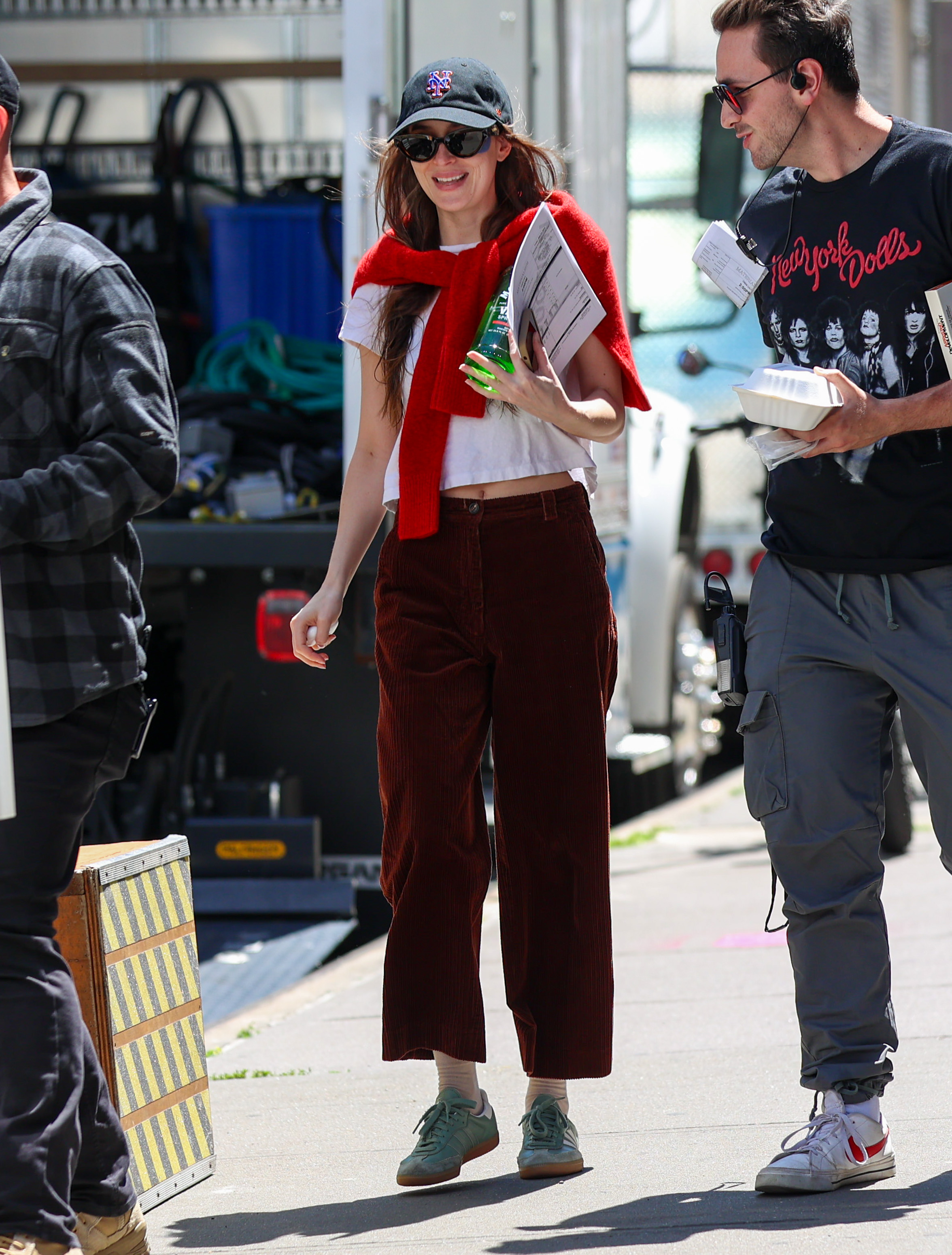 Dakota Johnson wears green Adidas Sambas sneakers on the set of 'Materialists.'
