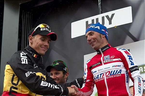 Defending champion Philippe Gilbert shakes hands with 2012 winner Joaquim Rodriguez.