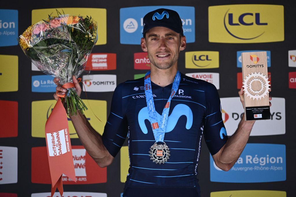 Movistar teams Spanish rider Carlos Verona celebrates on the podium after winning the seventh stage of the 74th edition of the Criterium du Dauphine cycling race 135kms between SaintChaffrey to Vaujany southeastern France on June 11 2022 Photo by Marco BERTORELLO AFP Photo by MARCO BERTORELLOAFP via Getty Images