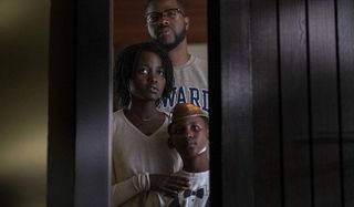 Us Lupita N'yongo Winston Duke Evan Alex looking out their window at the family in the driveway