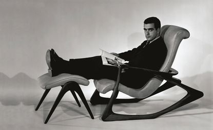 Vladimir Kagan with his 'Contour Rocking Chair' and 'Foot Stool'