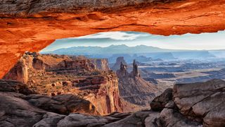 Morning light illuminates the underside of Mesa Arch in Canyonlands National Park.