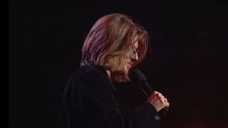 Side view of Mitch Hedberg doing standup