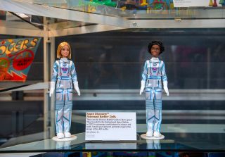 Billed incorrectly as the "first two Barbie dolls to fly to space," the "Space Discovery" figures that spent several months on board the International Space Station are seen on display the National Air and Space Museum's Steven F. Udvar-Hazy Center in Chantilly, Virginia.