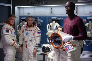 From left, Martin Cummins, Mark Ivanir and Ato Essandoh in "Away" on Netflix.