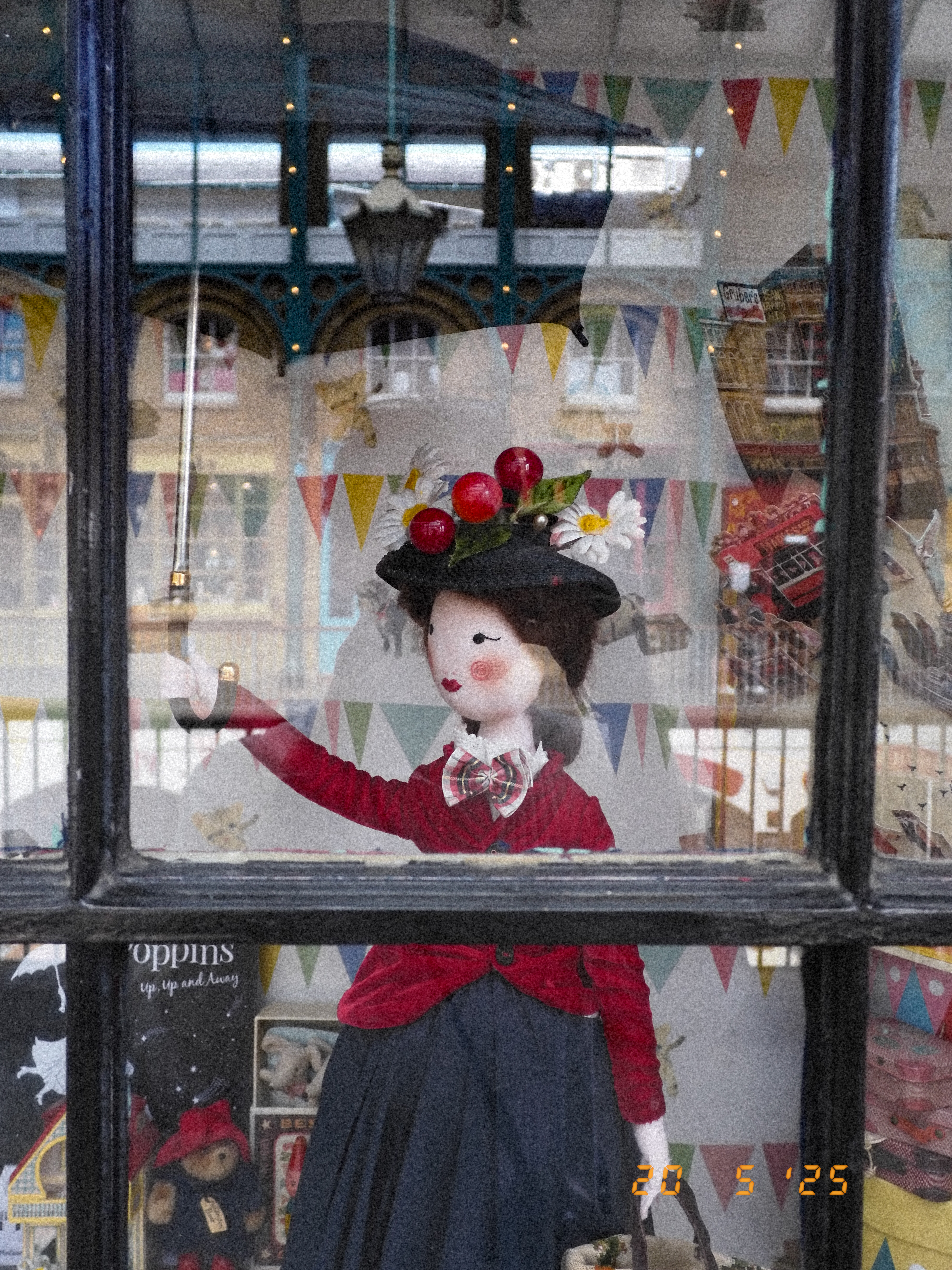 A doll of Mary Poppins in a store window