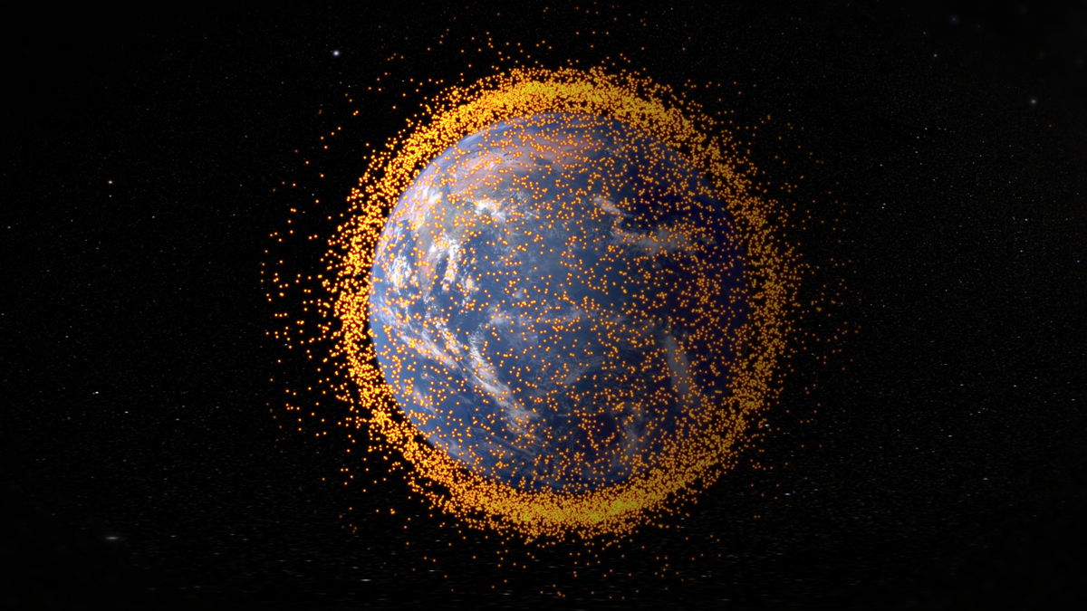Изглед на Земята от космоса, изцяло заобиколен от космически отпадъци.