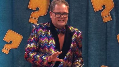 Alan Carr presenting a fake quiz show