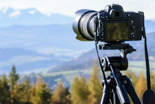 Camera on a tripod in the countryside