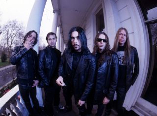 Monster Magnet standing on the front porch of a house