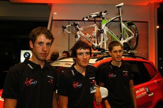 Rhys Gillett relaxes with two of his teammates in their 2XU clothing, while they wait for the presentation to start.