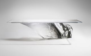 Dining table with glass top and glacier shaped base
