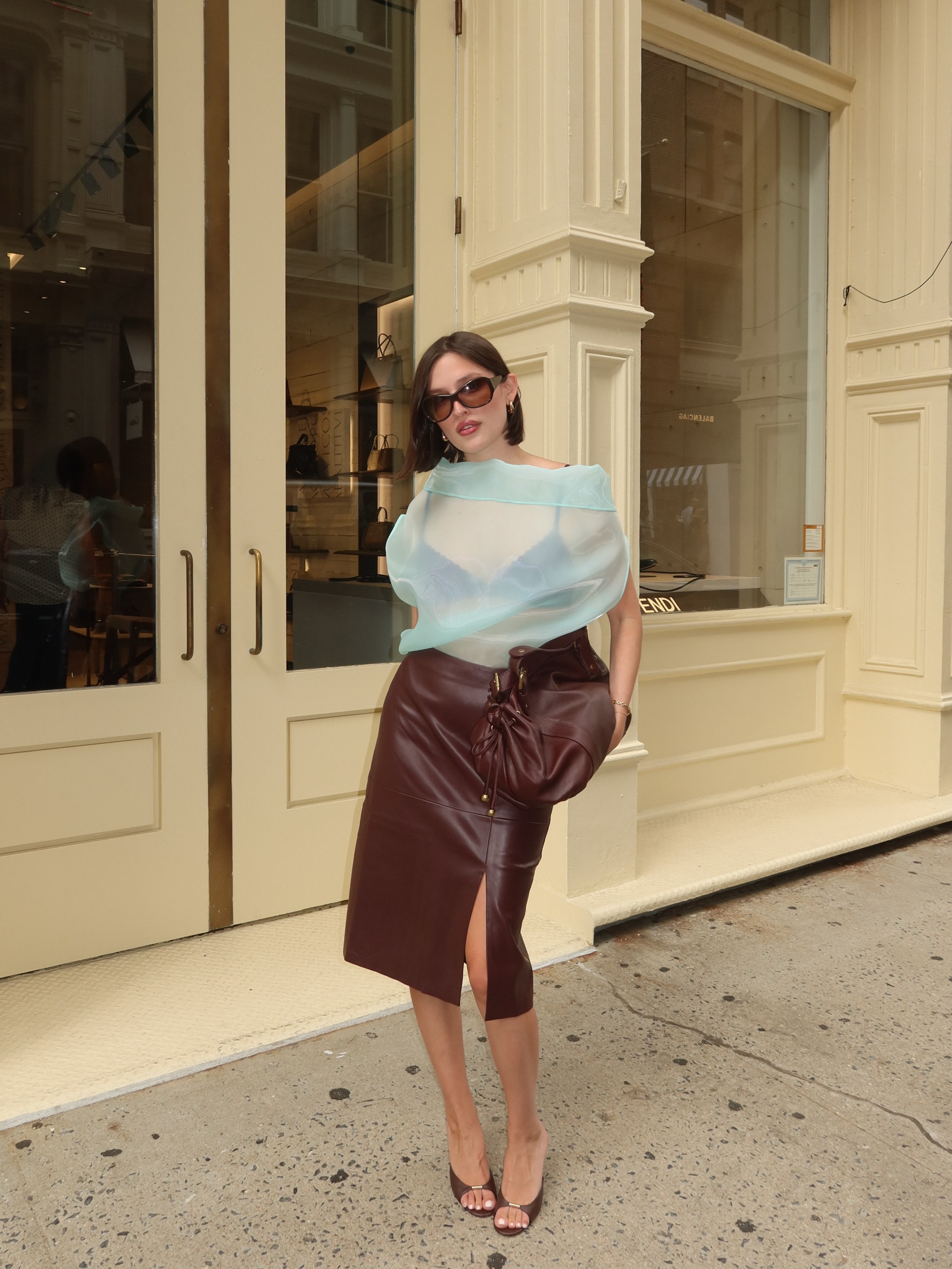 An image of a woman wearing skirt with slits outfit fall 2026