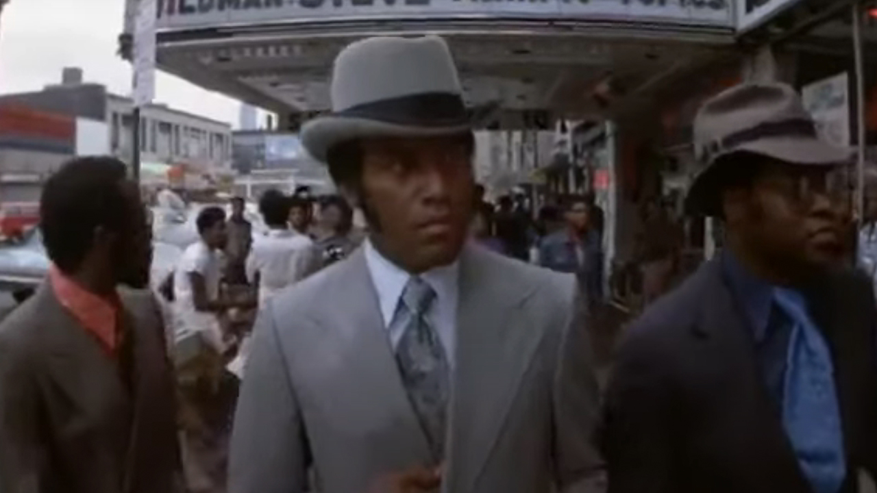 Three men walking in suits in Black Caesar.