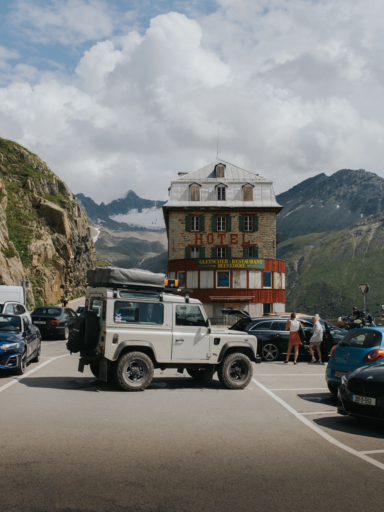Land Rover Defender in front of the Hotel-Restaurant Belv&eacute;d&egrave;re in Switzerland