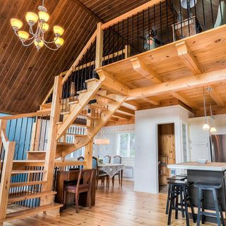 house interior with wooden floor and wooden stairs