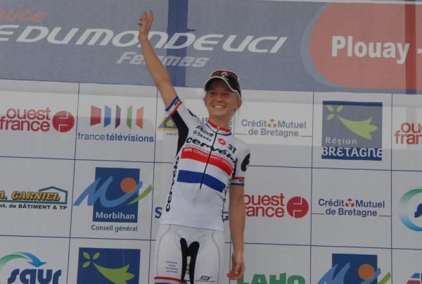 Emma Pooley celebrates atop the podium