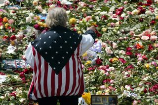 A woman pays tribute to victims of the 9/11 terrorist attacks in the United States.