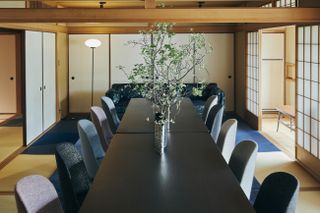 Table and chairs inside Stella Works and HOSOO Textiles' Kyoto Showroom