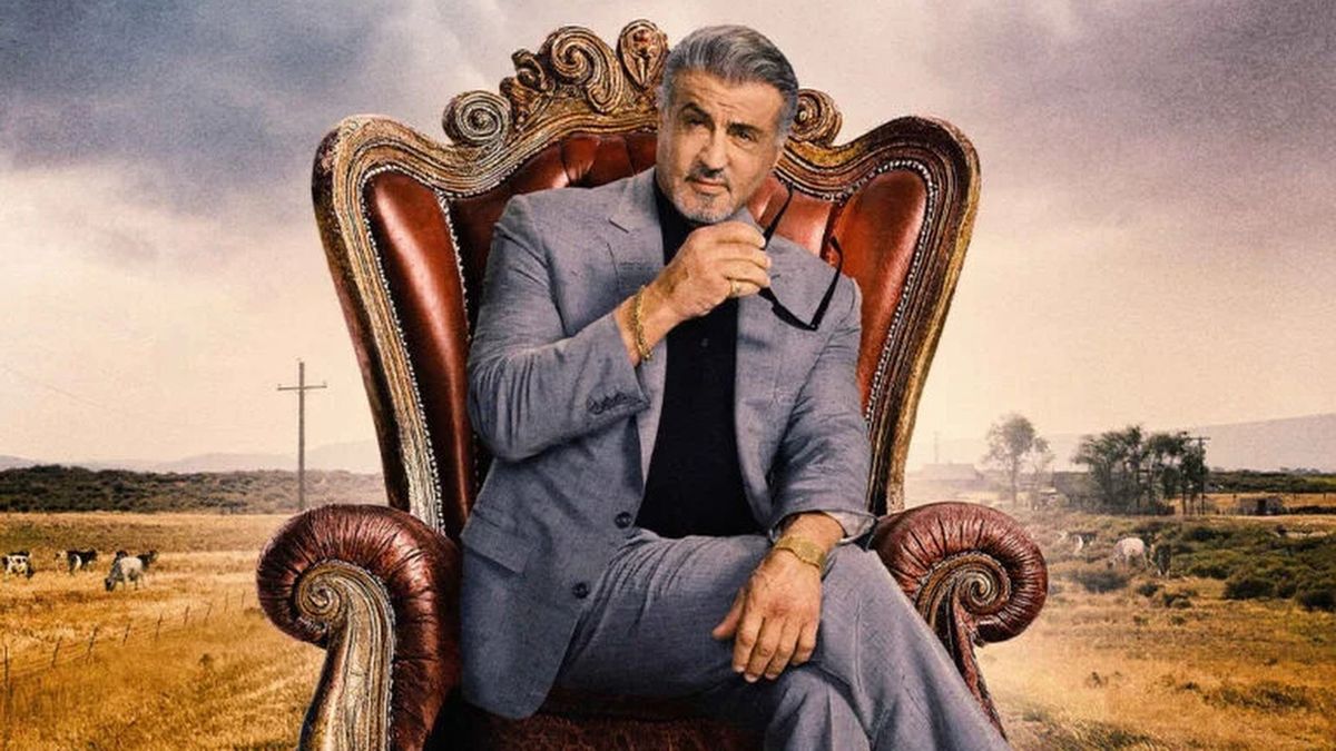 Sylvester Stallone as Dwight sits on a throne in an outdoor rural setting in a promotional image for Tulsa King season 2