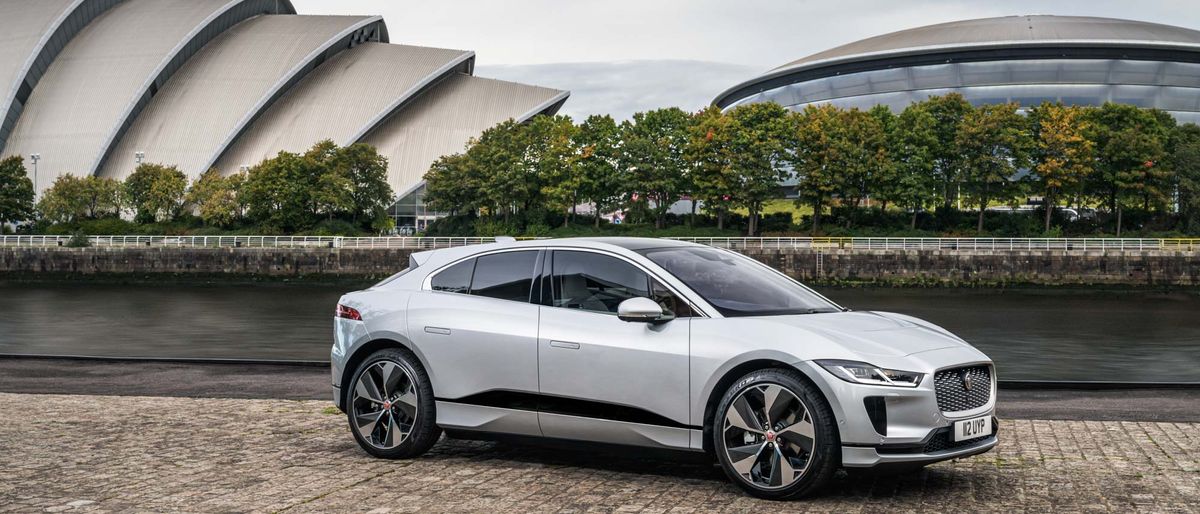 Jaguar I-Pace parked on street along waterfront