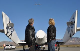 Burt Rutan of Scaled Composites and Sir Richard Branson of Virgin Galactic look on as their space plane, SpaceShipTwo, prepares for its first solo glide test.