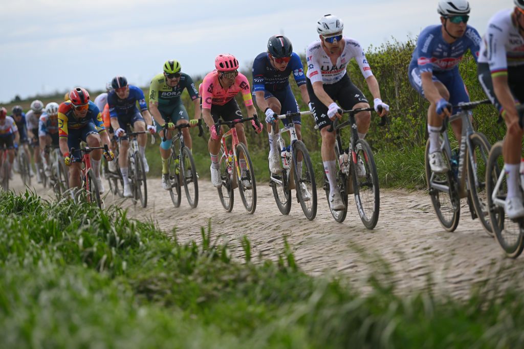 ROUBAIX FRANCE APRIL 07 LR Stefan Bissegger of Switzerland and Team EF Education EasyPost and Laurence Pithie of New Zealand and Team Groupama FDJ compete passing through the Capelle Ruesnes cobblestones sector during the 121st ParisRoubaix 2024 a 2597km one day race from Compiegne to Roubaix UCIWT on April 07 2024 in Roubaix France Photo by Dario BelingheriGetty Images