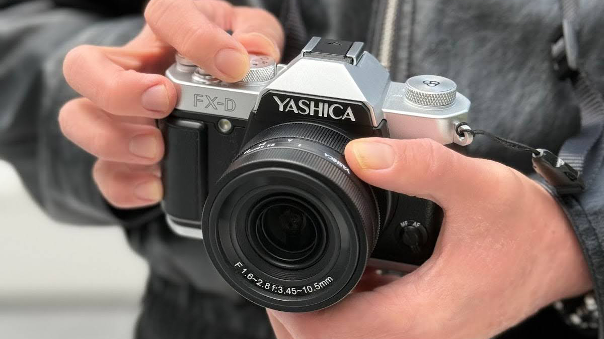 The Yashica FX-D held in a person's hands
