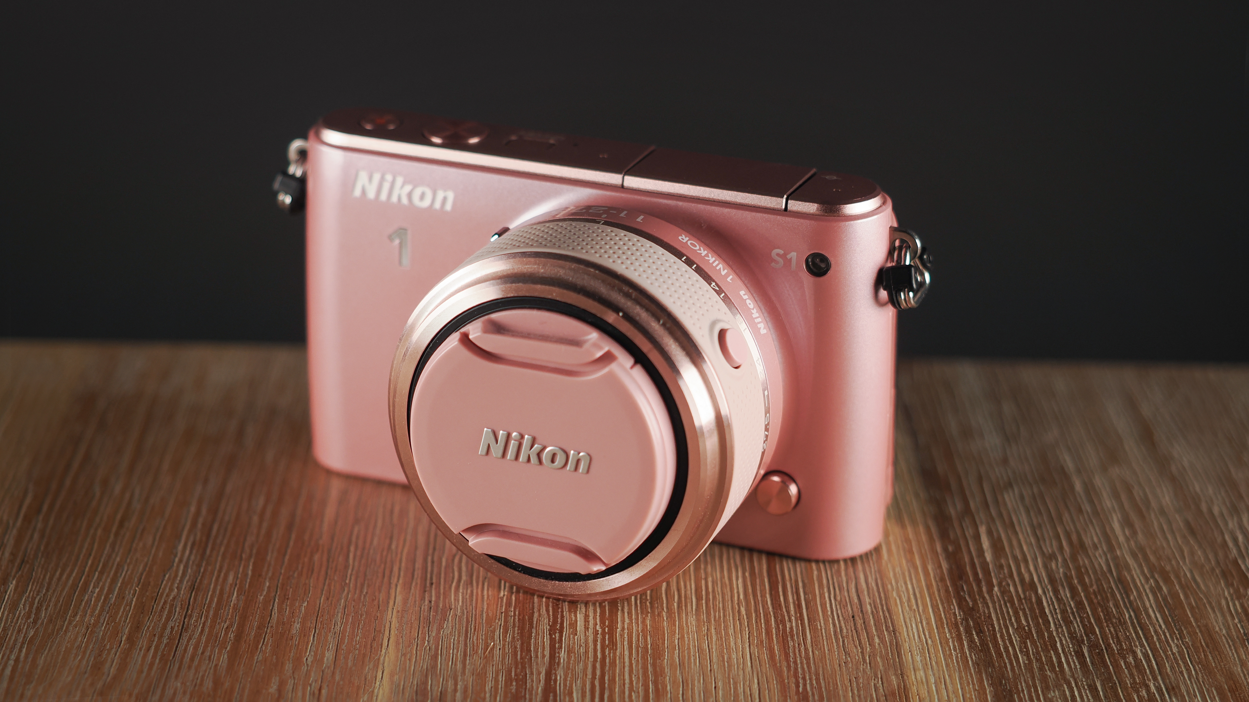 Nikon 1 S1 on a wooden surface