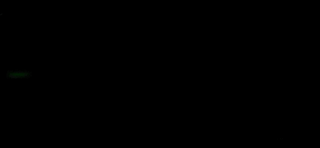 A glowing green sphere against a black background