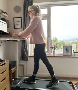 Woman walking on a under-desk treadmill