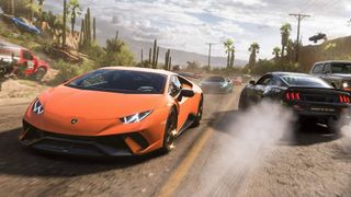 An orange Lamborghini speeds past other racers on a dusty road