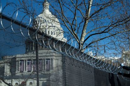 The Capitol behind barbed wire.