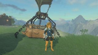 Link stands next to a hot air balloon wearing the Zora armor