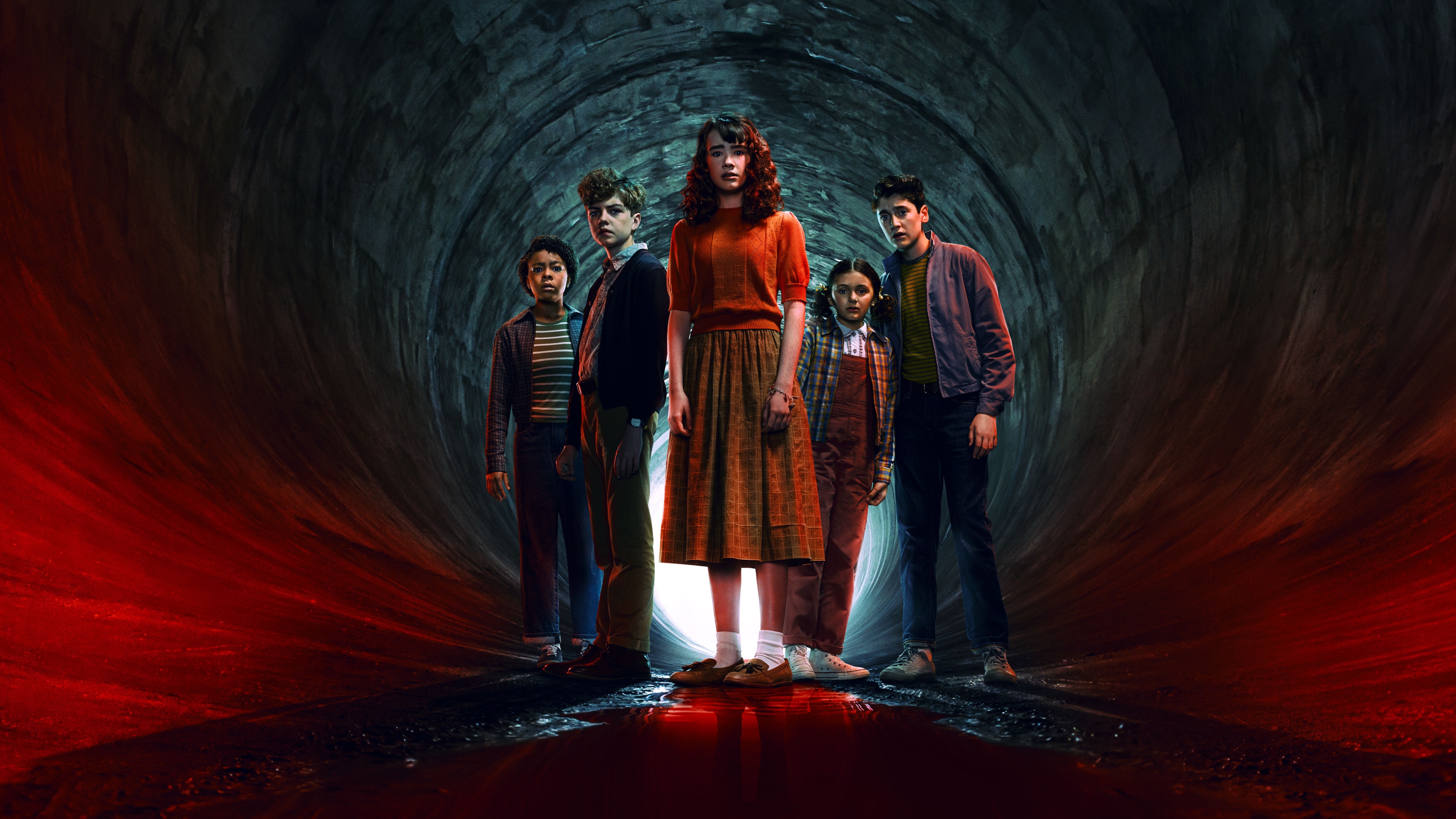 It: Welcome to Derry key art. The cast of It: Welcome to Derry standing in a tunnel.